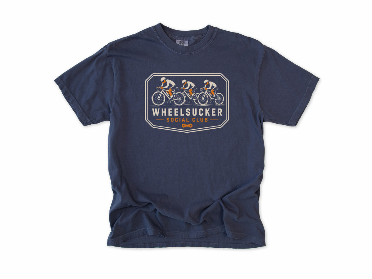 Funny cycling T-shirt in Navy, Wheelsucker: three cyclists in a paceline on an orange and cream badge, 'Social Club', for road cyclists