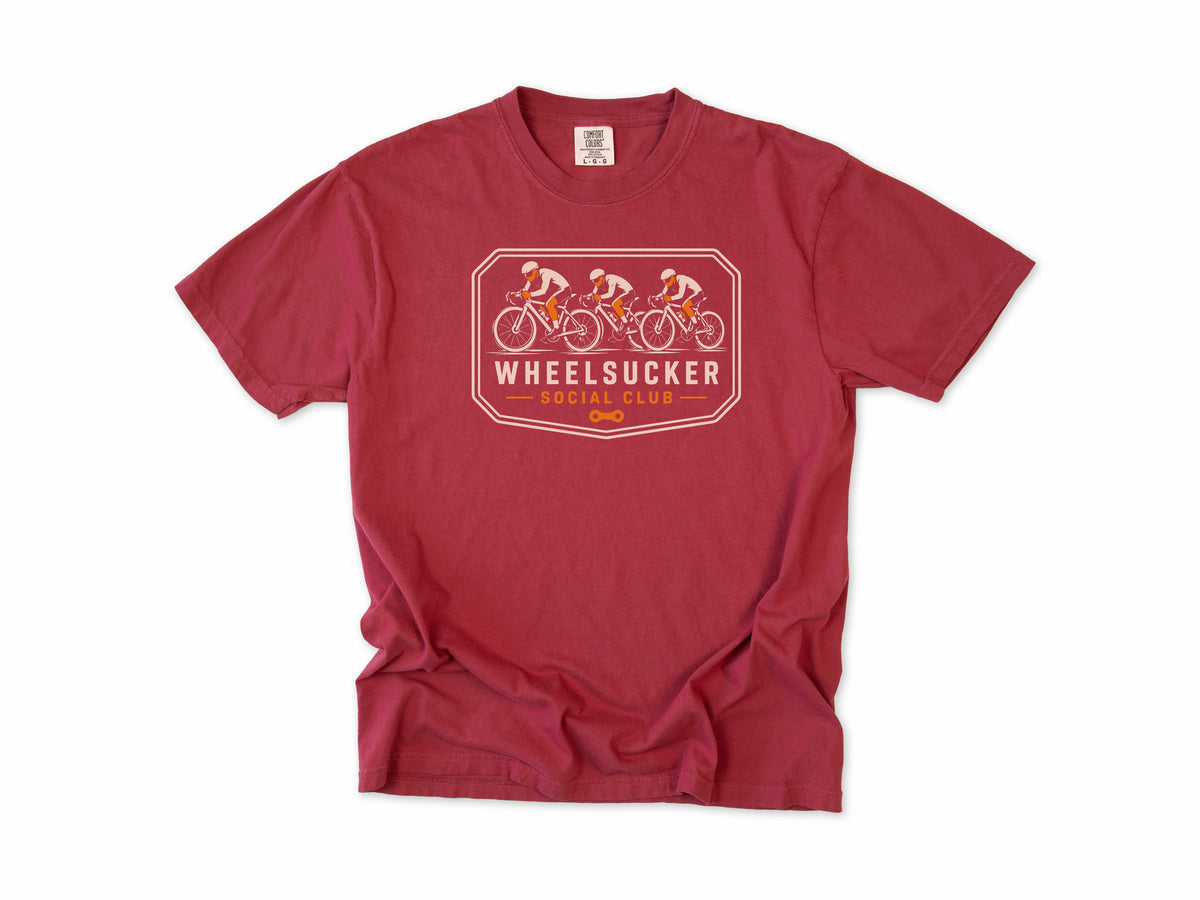 Funny cycling T-shirt in Chili, Wheelsucker: three cyclists in a paceline on an orange and cream badge, 'Social Club', for road cyclists