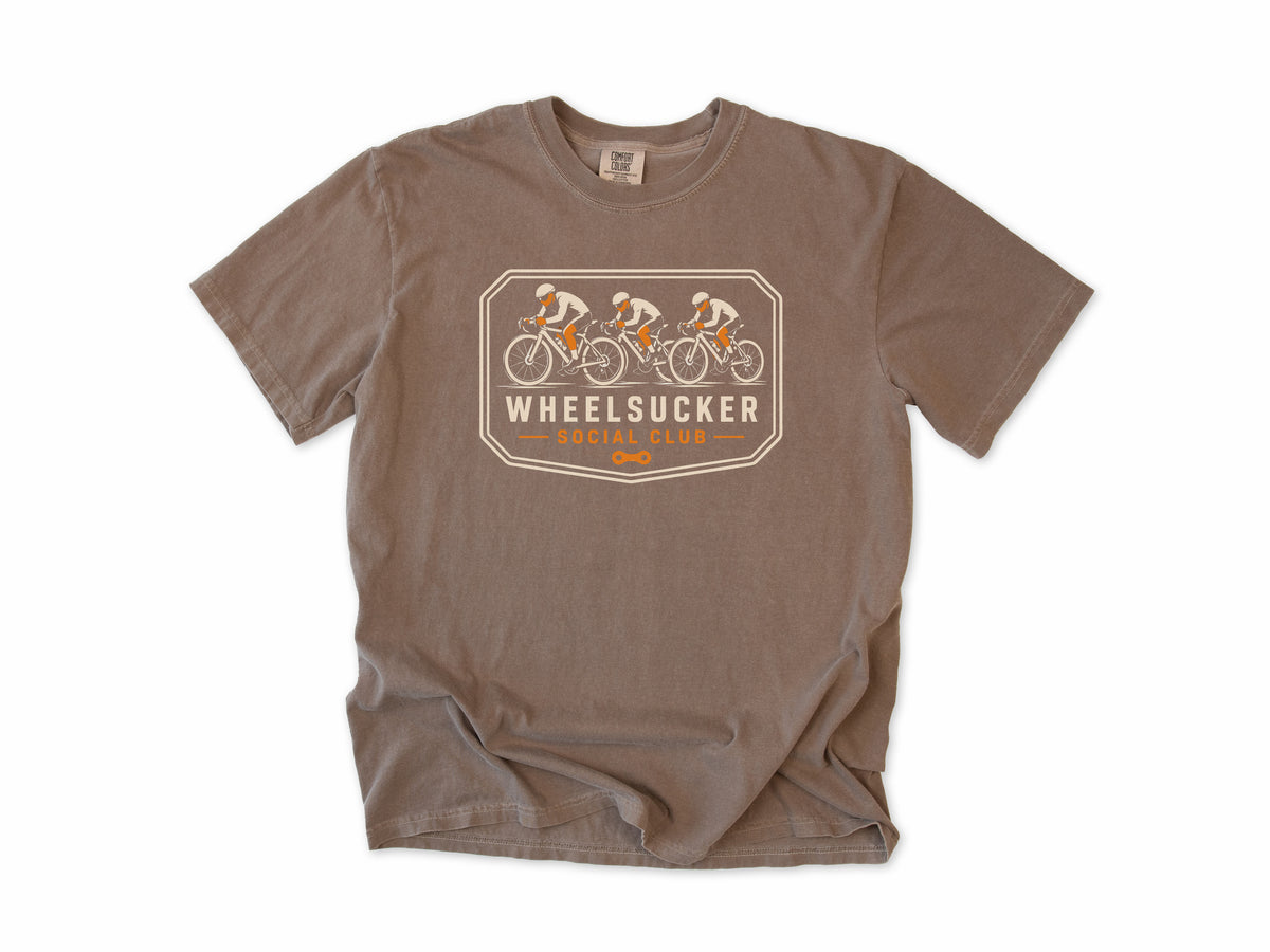 Funny cycling T-shirt in Espresso, Wheelsucker: three cyclists in a paceline on an orange and cream badge, 'Social Club', for road cyclists