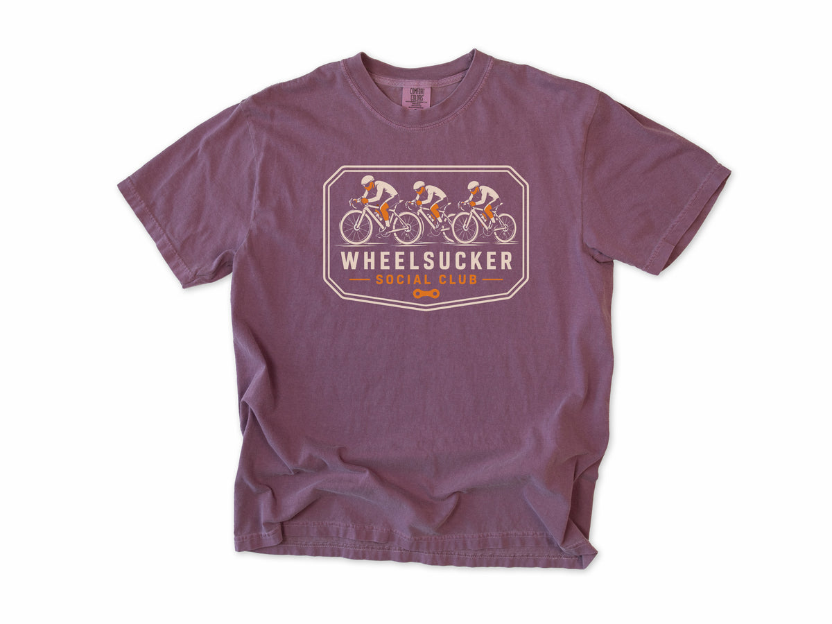 Funny cycling T-shirt in Berry, Wheelsucker: three cyclists in a paceline on an orange and cream badge, 'Social Club', for road cyclists