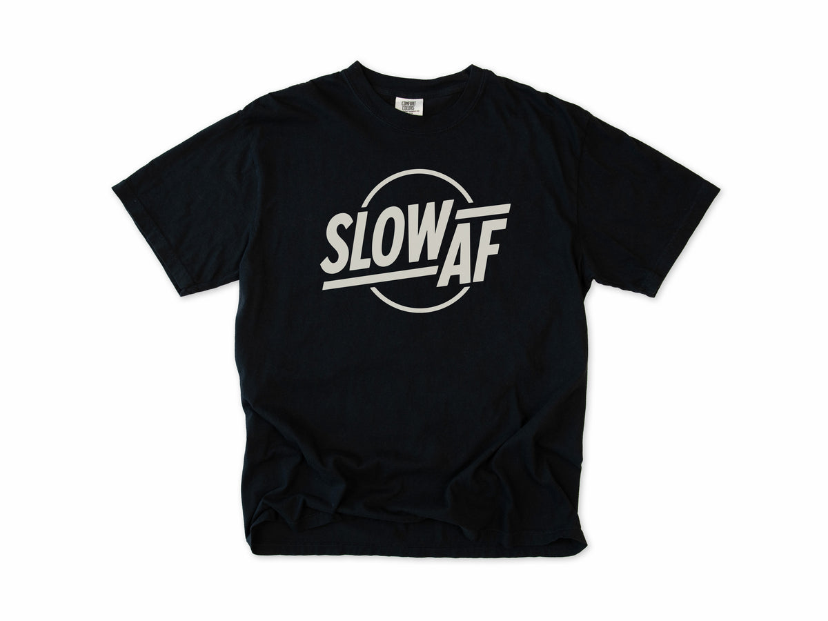 Funny cycling T-shirt in Black, 'Slow AF' in bold letters inside a circle, for relaxed riders