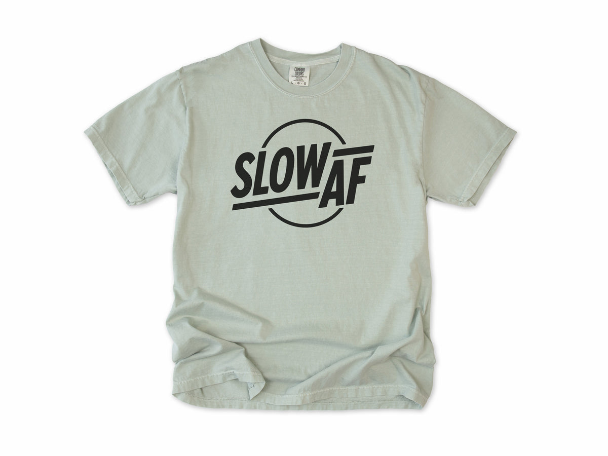 Funny cycling T-shirt in Bay, 'Slow AF' in bold letters inside a circle, for relaxed riders