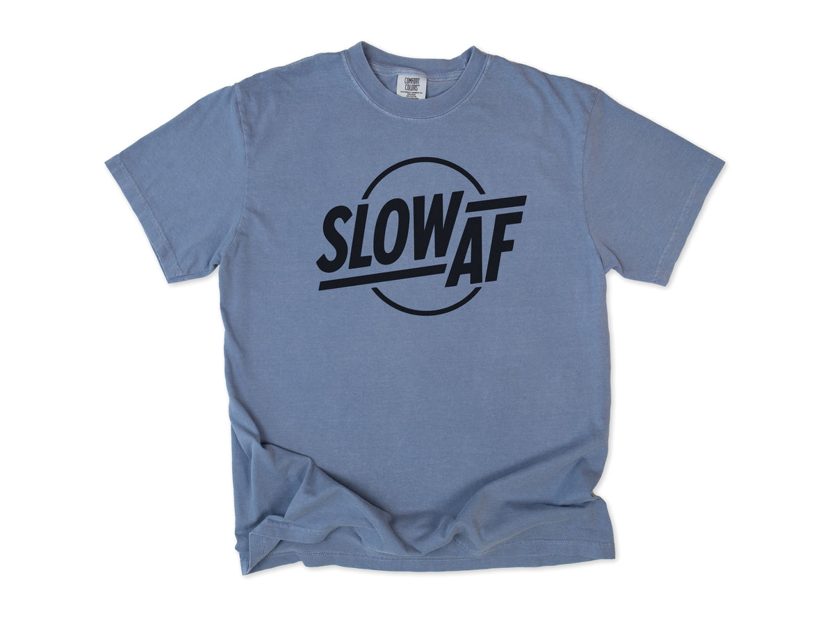 Funny cycling T-shirt in Blue Jean, 'Slow AF' in bold letters inside a circle, for relaxed riders