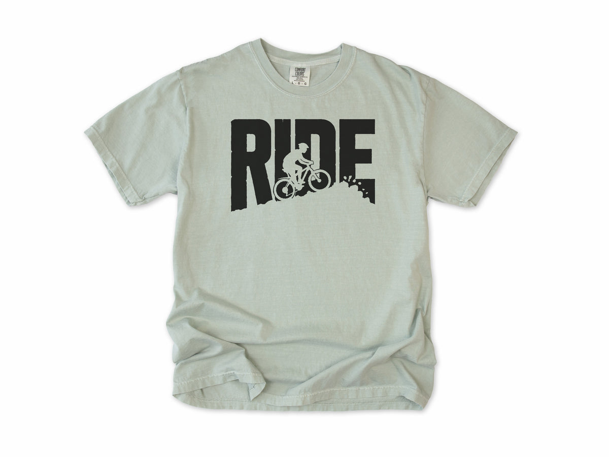 Cycling T-shirt in Bay, bold 'RIDE' letters with a mountain biker on a slope, for mountain bikers
