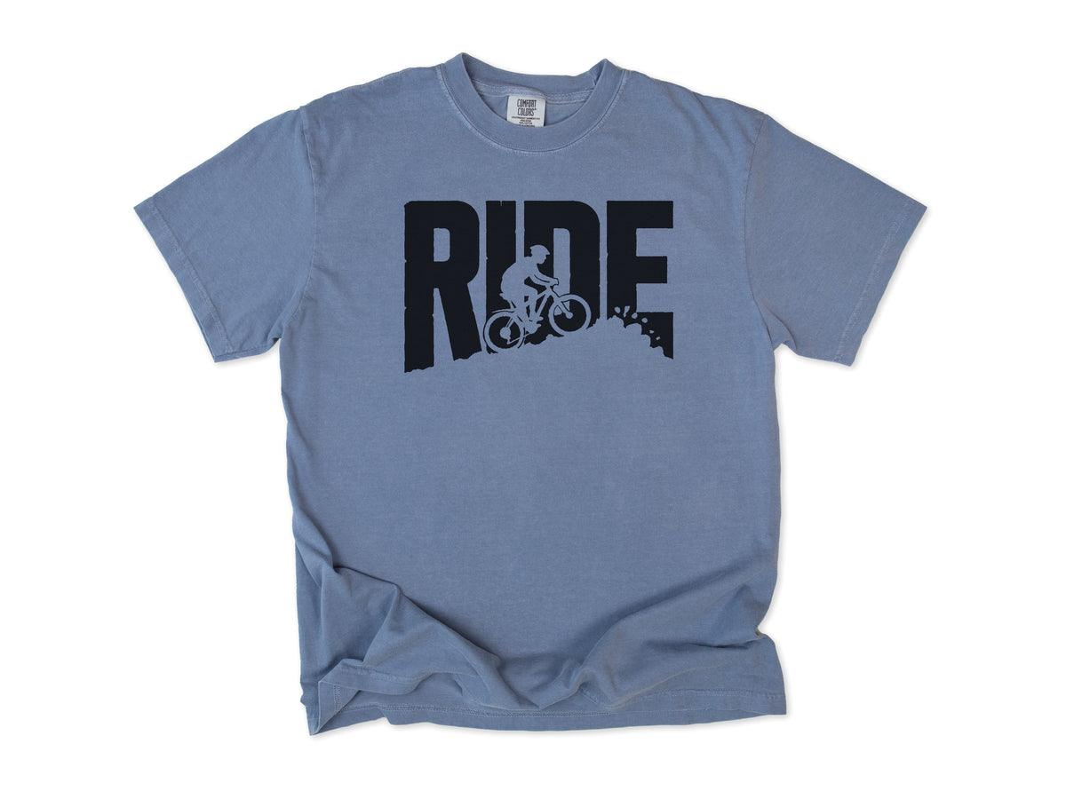 Cycling T-shirt in Blue Jean, bold 'RIDE' letters with a mountain biker on a slope, for mountain bikers