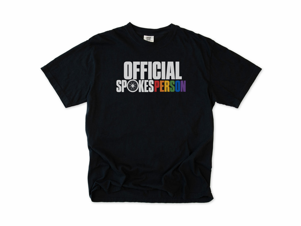 Funny cycling T-shirt in Black, 'Official Spokesperson' with a wheel and rainbow lettering, for cyclists and allies