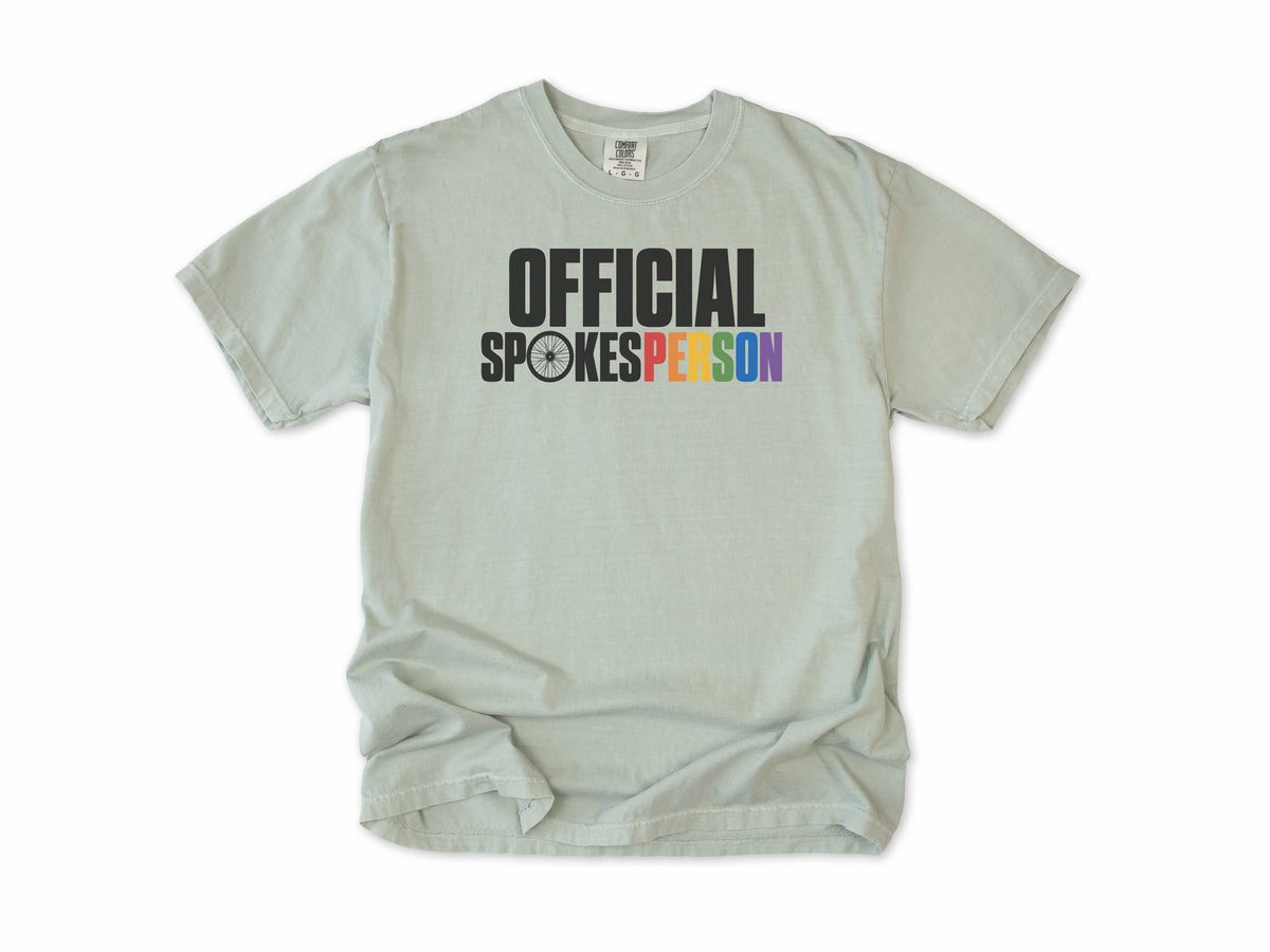Funny cycling T-shirt in Bay, 'Official Spokesperson' with a wheel and rainbow lettering, for cyclists and allies