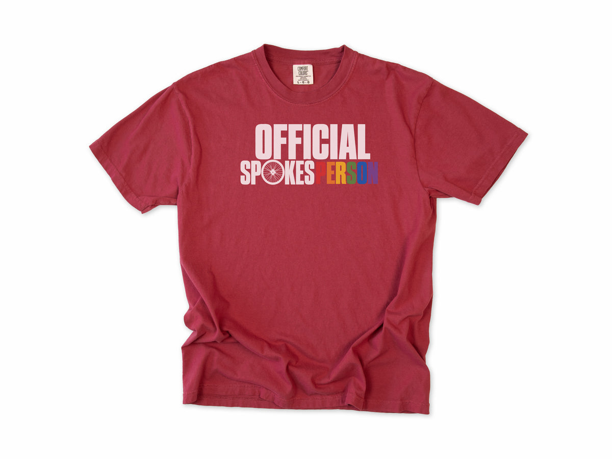 Funny cycling T-shirt in Chili, 'Official Spokesperson' with a wheel and rainbow lettering, for cyclists and allies
