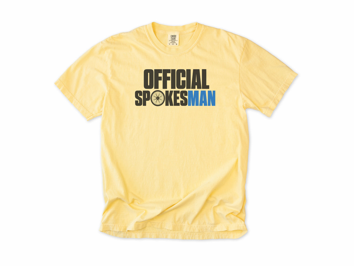 Funny cycling T-shirt in Butter, 'Official Spokesman' with a wheel and blue lettering, gift for a cyclist