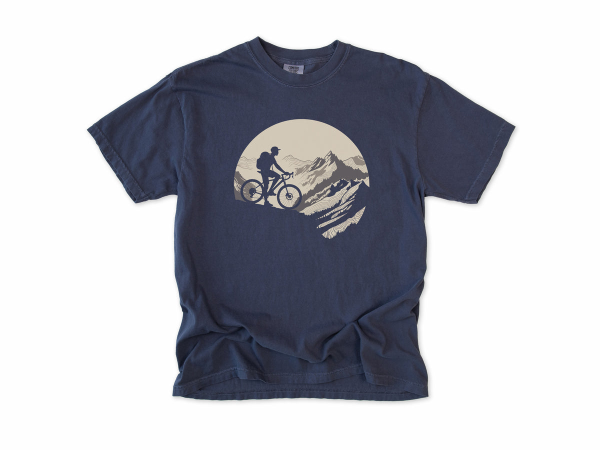 Cycling T-shirt in Navy, a mountain biker climbing a rocky peak, in a circle, for mountain bikers