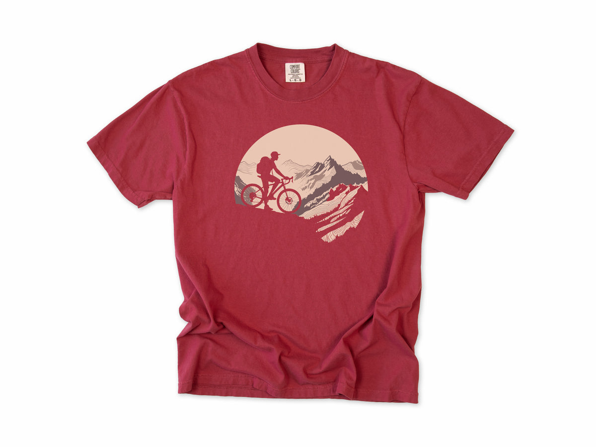 Cycling T-shirt in Chili, a mountain biker climbing a rocky peak, in a circle, for mountain bikers