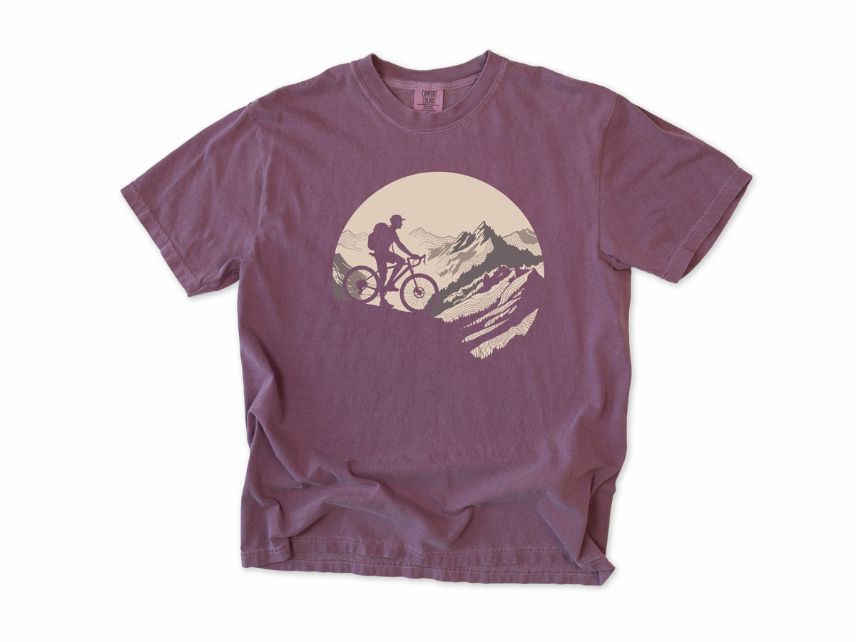 Cycling T-shirt in Berry, a mountain biker climbing a rocky peak, in a circle, for mountain bikers