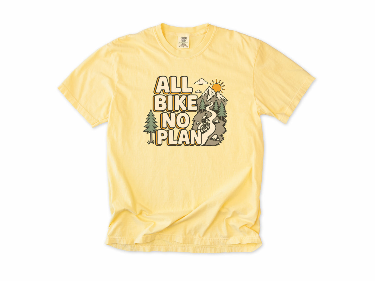 Cycling T-shirt in Butter, 'All Bike No Plan' with a mountain trail, for gravel and mountain bikers