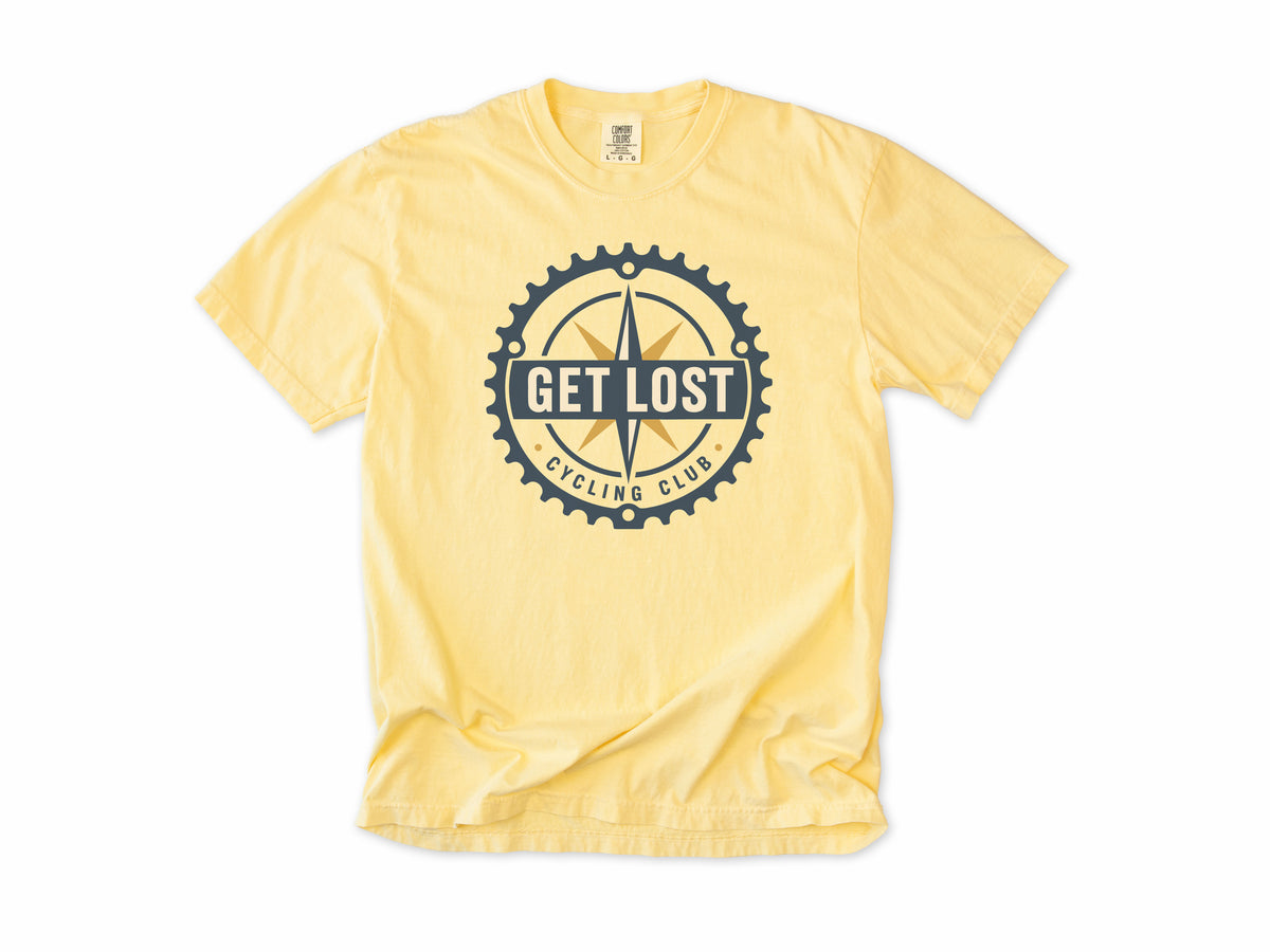 Cycling T-shirt in Butter, 'Get Lost Cycling Club', a compass in a chainring, for gravel and touring riders