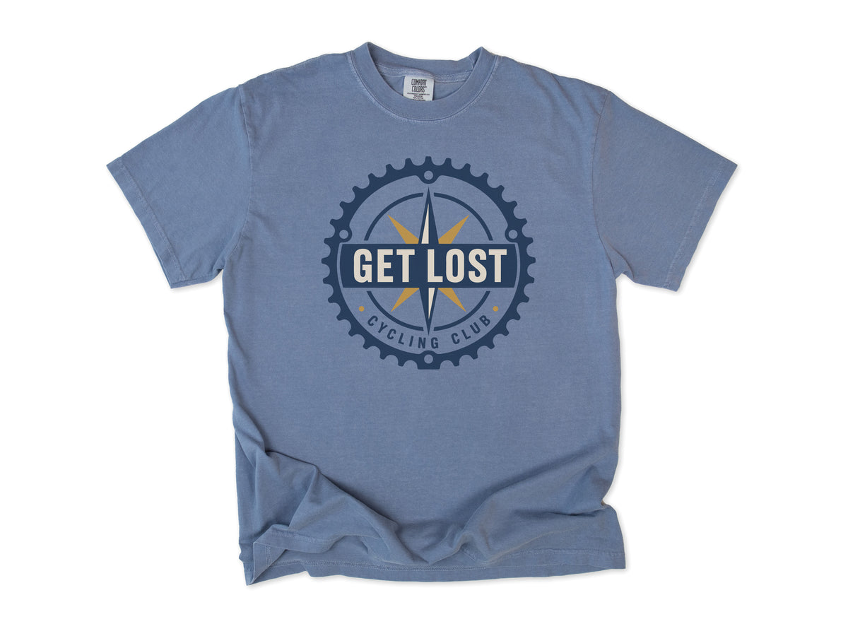 Cycling T-shirt in Blue Jean, 'Get Lost Cycling Club', a compass in a chainring, for gravel and touring riders