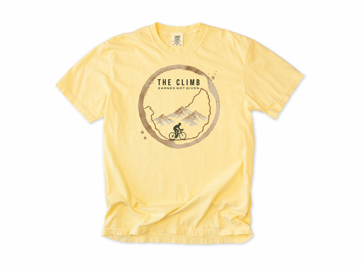 Funny cycling T-shirt in Butter, 'The Climb', a coffee ring with a climbing cyclist, for coffee-loving climbers