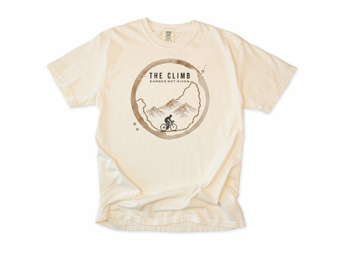 Funny cycling T-shirt in Ivory, 'The Climb', a coffee ring with a climbing cyclist, for coffee-loving climbers