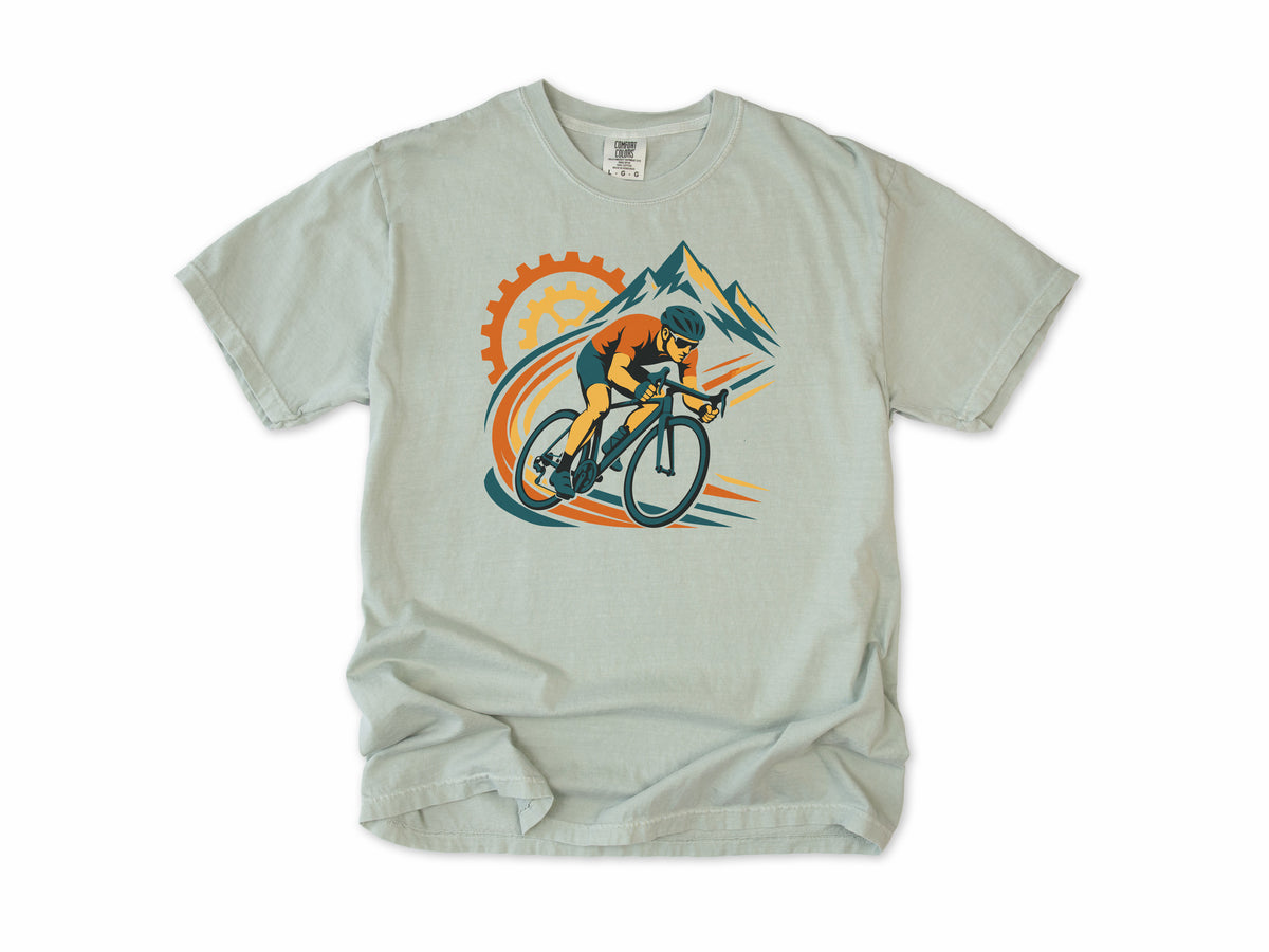Cycling T-shirt in Bay, a cyclist before a chainring and mountains with orange swooshes, for road cyclists