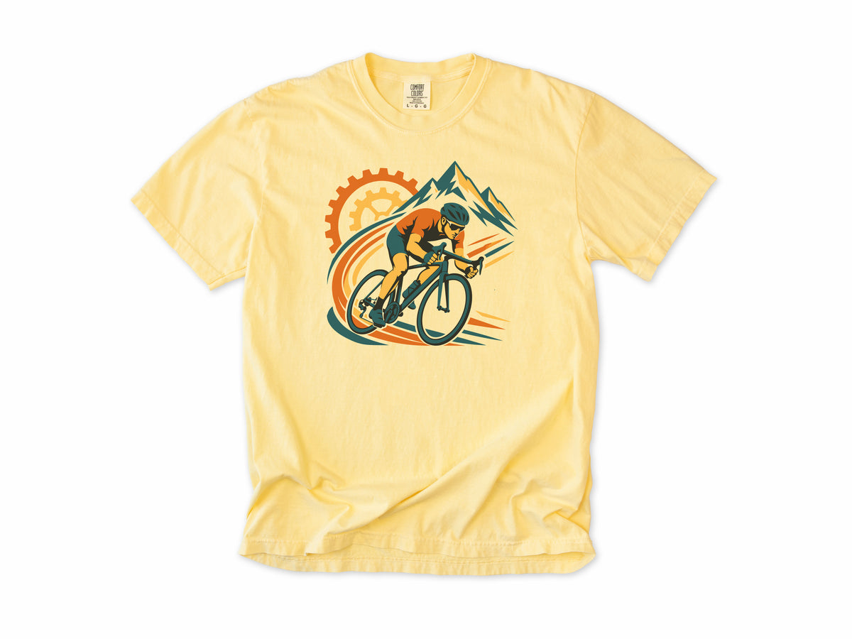 Cycling T-shirt in Butter, a cyclist before a chainring and mountains with orange swooshes, for road cyclists