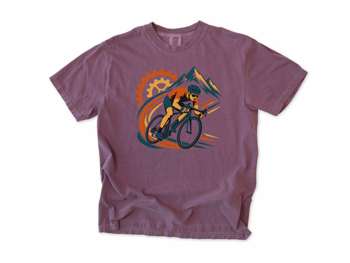 Cycling T-shirt in Berry, a cyclist before a chainring and mountains with orange swooshes, for road cyclists