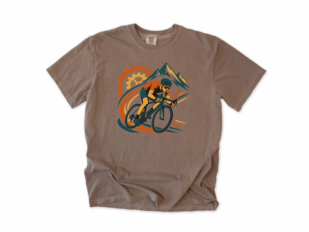 Cycling T-shirt in Espresso, a cyclist before a chainring and mountains with orange swooshes, for road cyclists