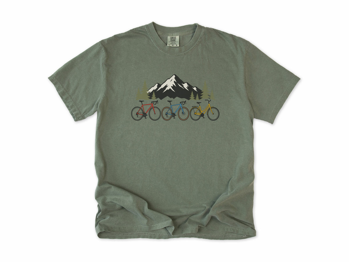Cycling T-shirt in Moss, three bikes in front of a snowy mountain, for road and mountain bikers