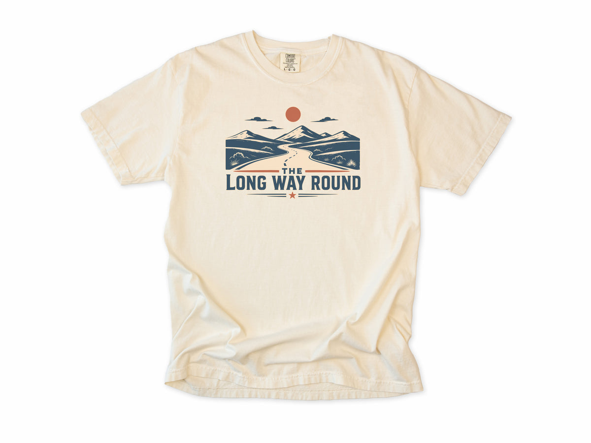 Cycling T-shirt in Ivory, 'The Long Way Round' with a winding road through mountains, for touring and gravel cyclists
