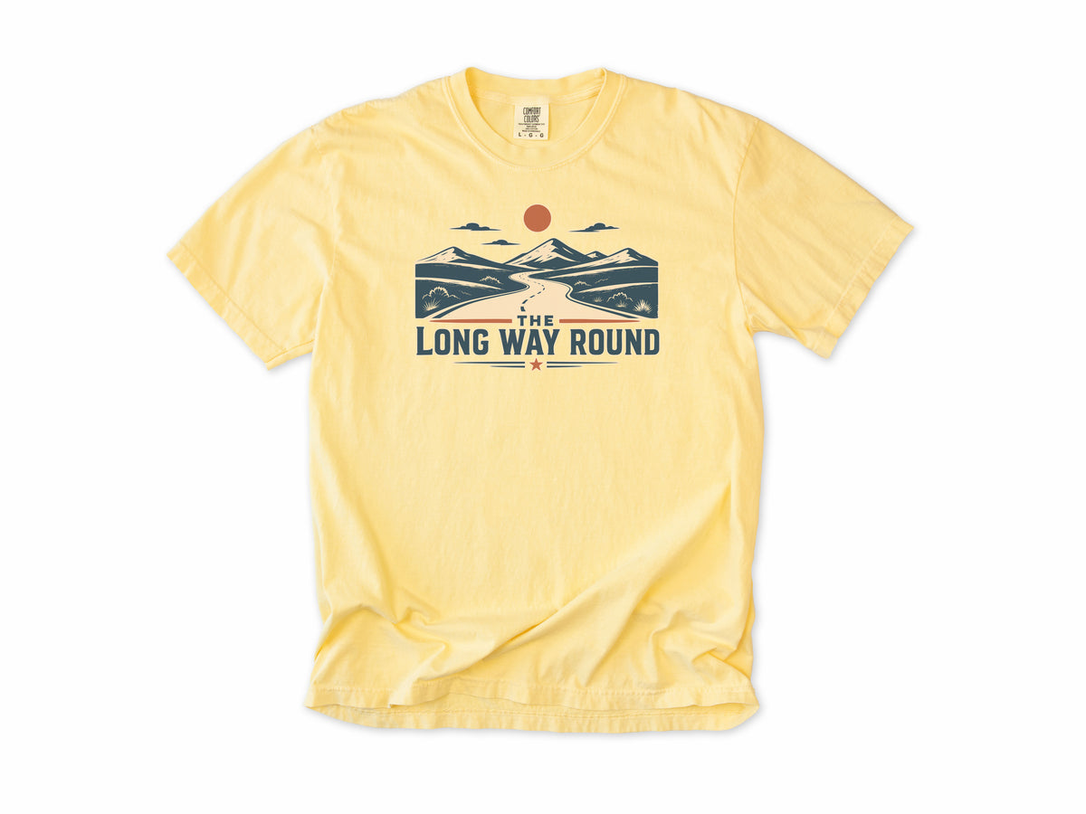 Cycling T-shirt in Butter, 'The Long Way Round' with a winding road through mountains, for touring and gravel cyclists