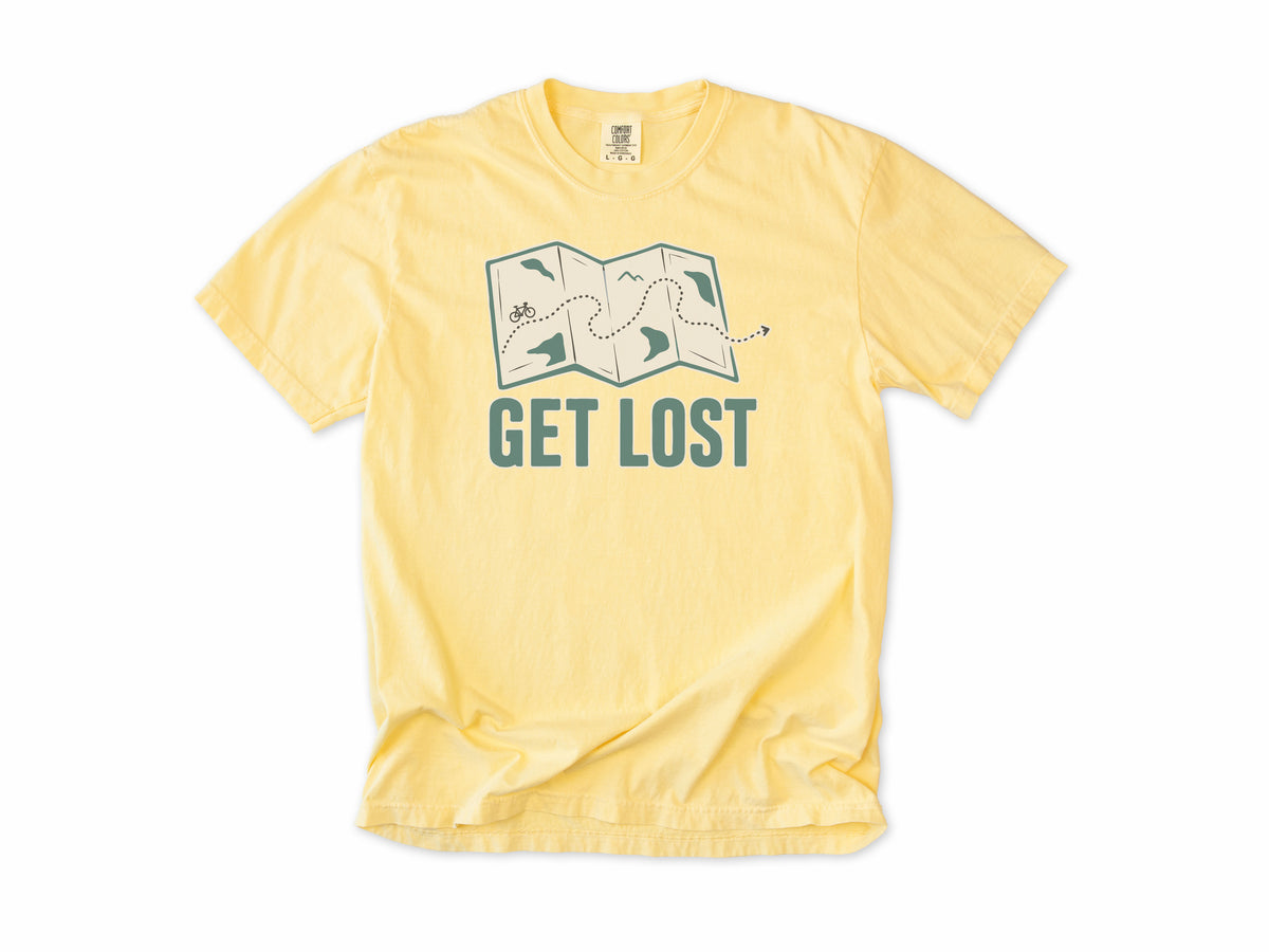 Cycling T-shirt in Butter, a folded map with a dotted bike route, 'Get Lost', for gravel and touring riders