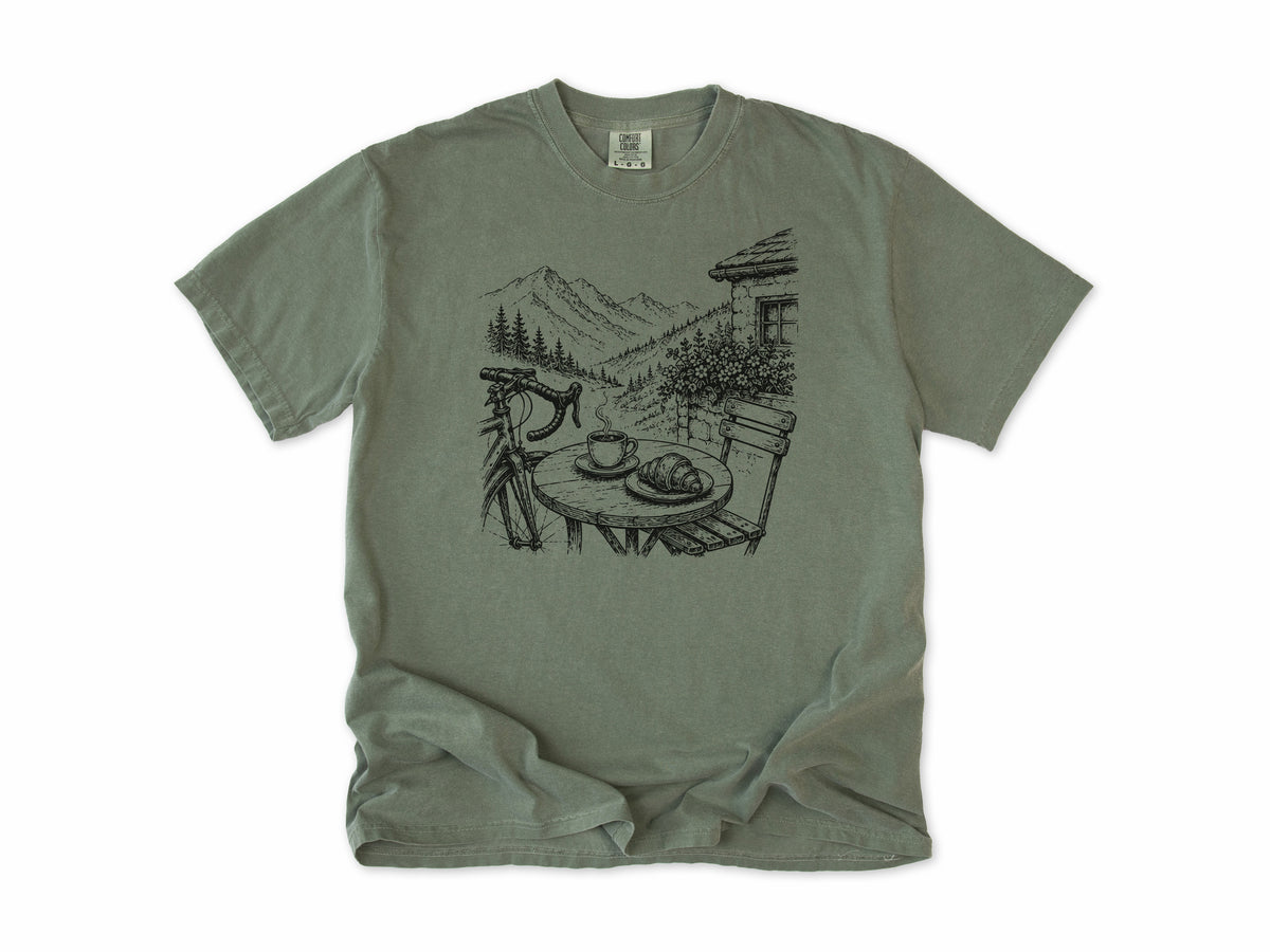 Cycling T-shirt in Moss, a sketch of a cafe table with coffee above an alpine valley, for cafe stop riders