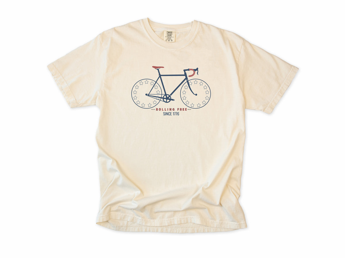 Cycling T-shirt in Ivory, Betsy Ross Bike: a road bike with star wheels, 'Rolling Free', America 250 and 4th of July gift for cyclists