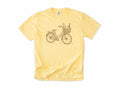 Cycling T-shirt in Butter, a vintage bike with a baguette and wine in its basket, for city and cafe cyclists