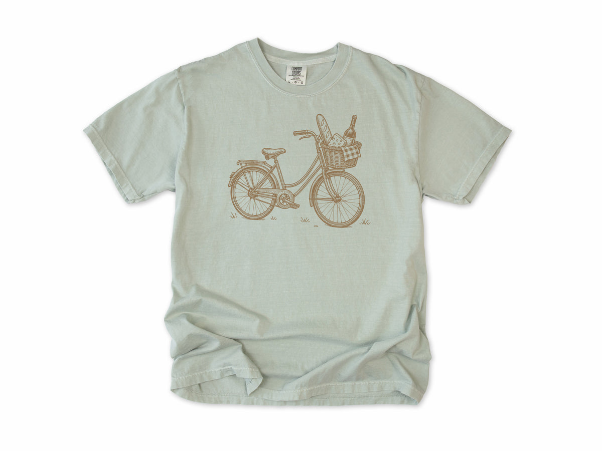 Cycling T-shirt in Bay, a vintage bike with a baguette and wine in its basket, for city and cafe cyclists