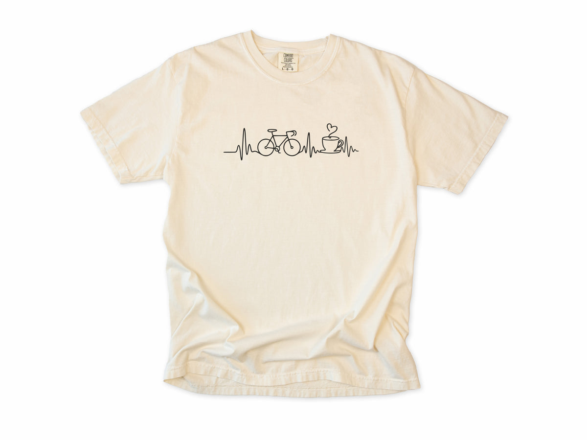 Cycling T-shirt in Ivory, a heartbeat line linking a bike and a coffee cup, for coffee-loving cyclists