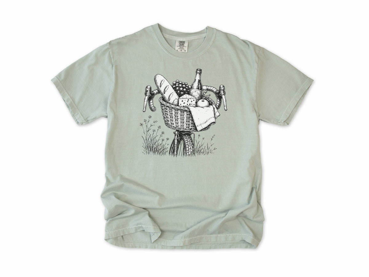 Cycling T-shirt in Bay, a bike basket with a baguette, cheese and wine, line drawing, for leisure and cafe cyclists