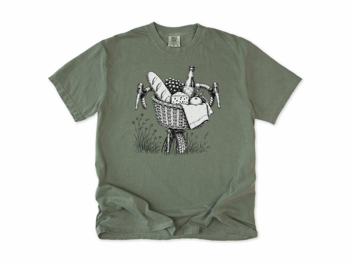 Cycling T-shirt in Moss, a bike basket with a baguette, cheese and wine, line drawing, for leisure and cafe cyclists