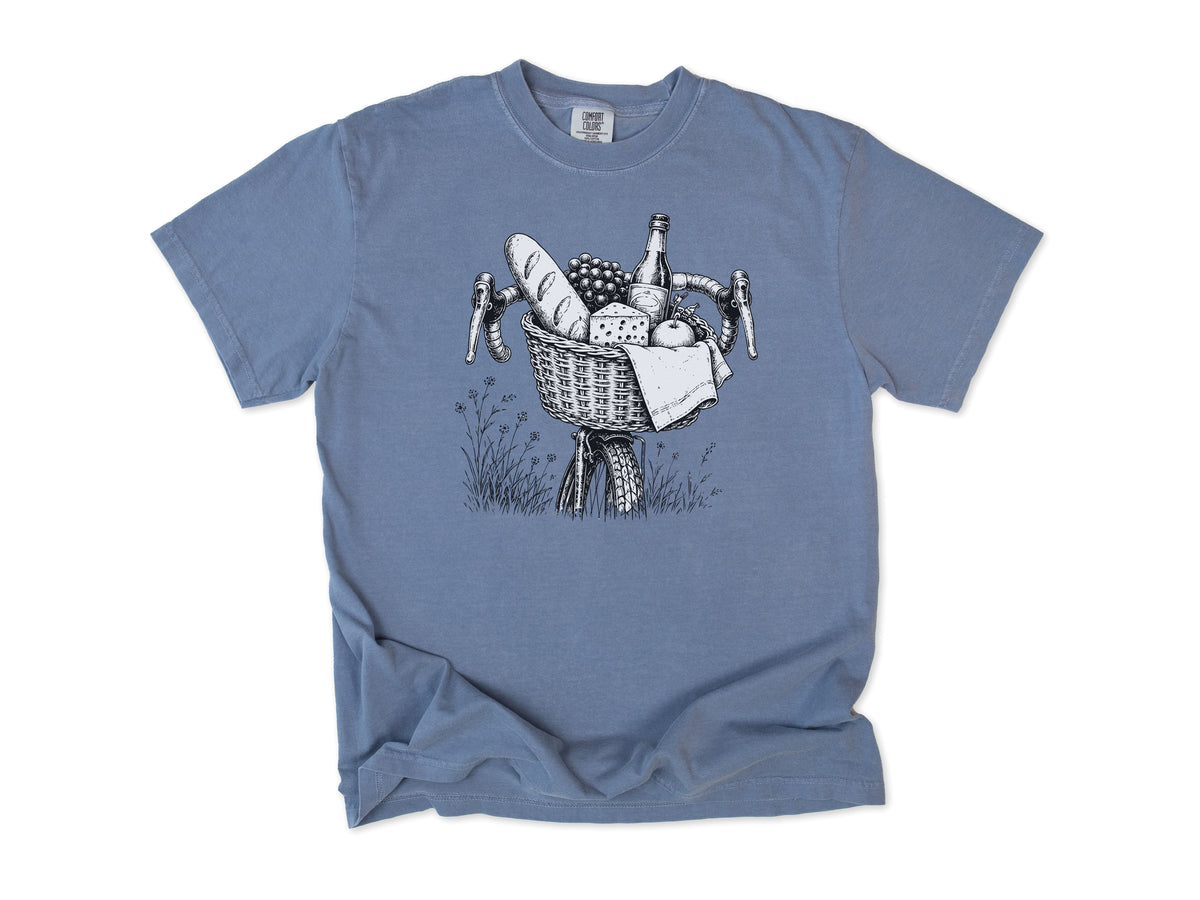 Cycling T-shirt in Blue Jean, a bike basket with a baguette, cheese and wine, line drawing, for leisure and cafe cyclists