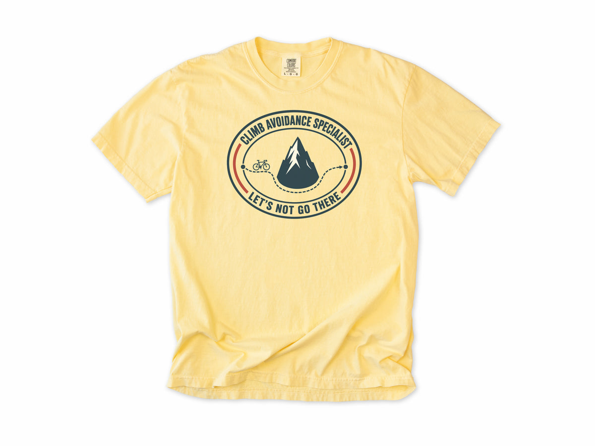 Funny cycling T-shirt in Butter, 'Climb Avoidance Specialist', a route around a mountain, for cyclists who avoid hills