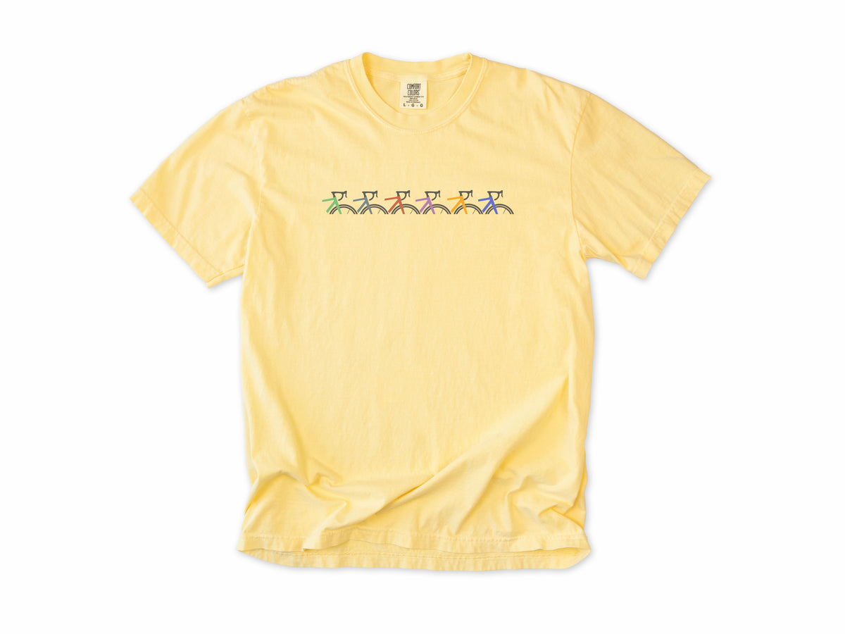 Cycling T-shirt in Butter, Cropped Bike: a row of six small colourful bike frames across the chest, for cyclists