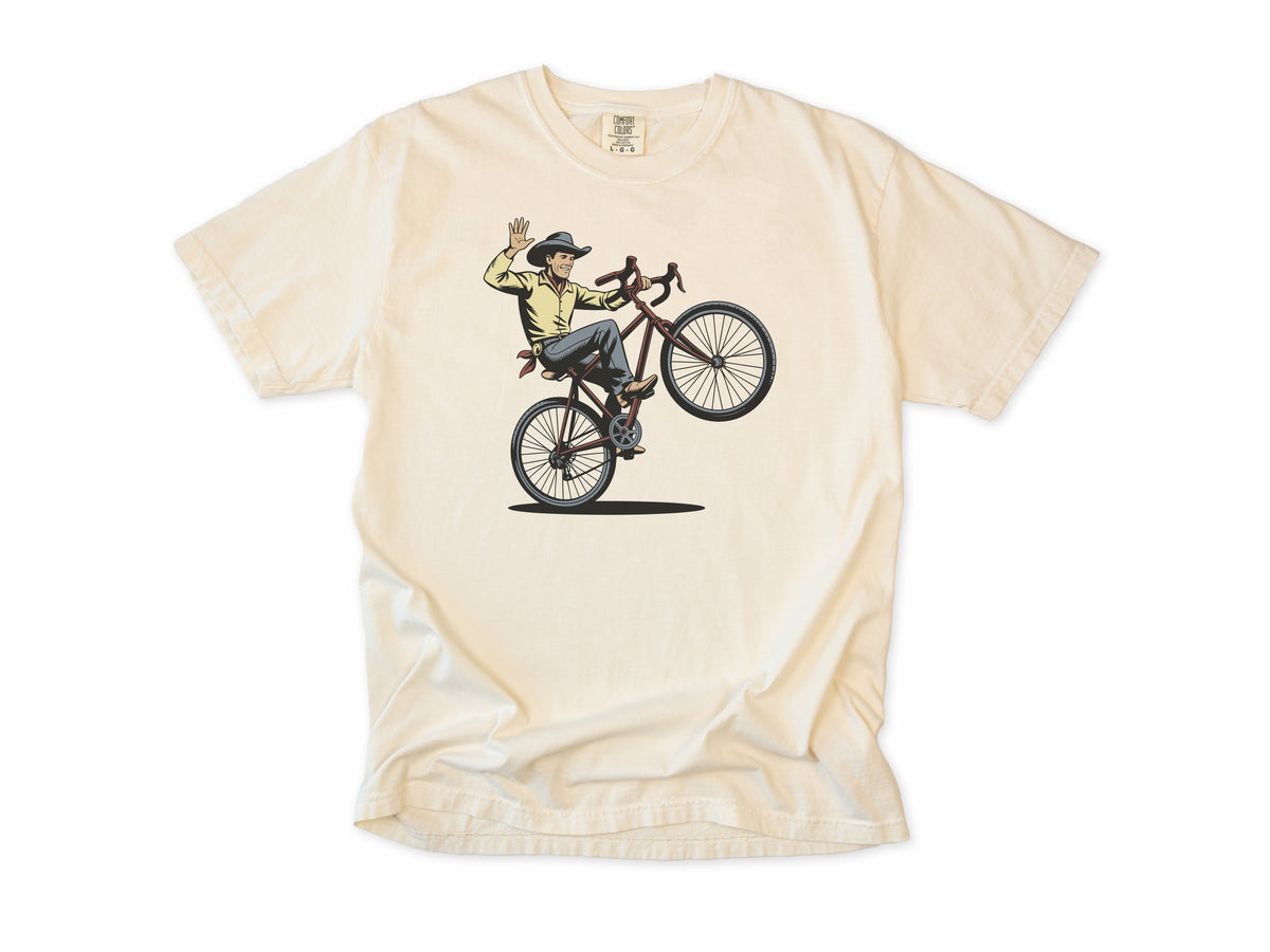 Cycling T-shirt in Ivory, a cowboy doing a wheelie and waving his hat, for mountain bikers