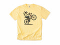 Cycling T-shirt in Butter, a cowboy doing a wheelie and waving his hat, for mountain bikers
