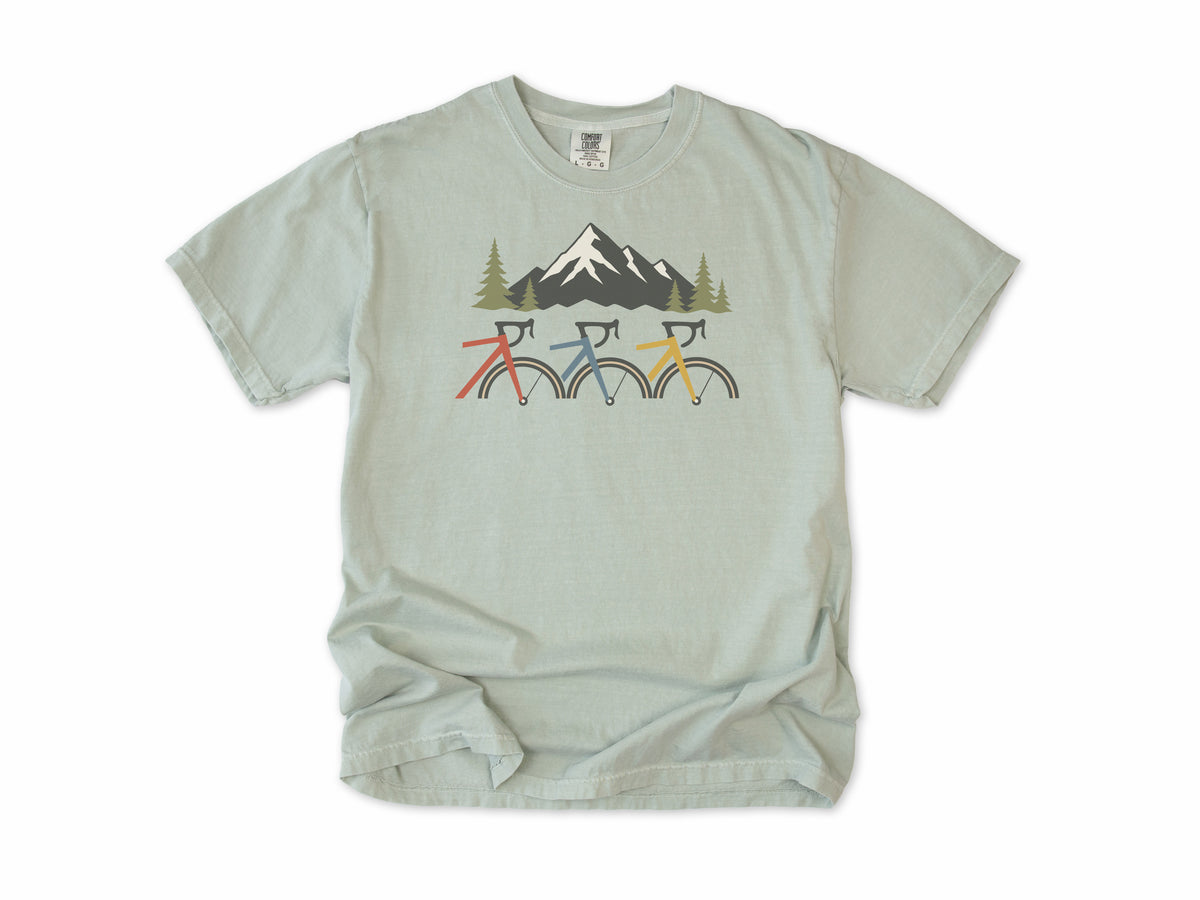 Cycling T-shirt in Bay, three cropped bikes under a snowy mountain, for road and mountain bikers