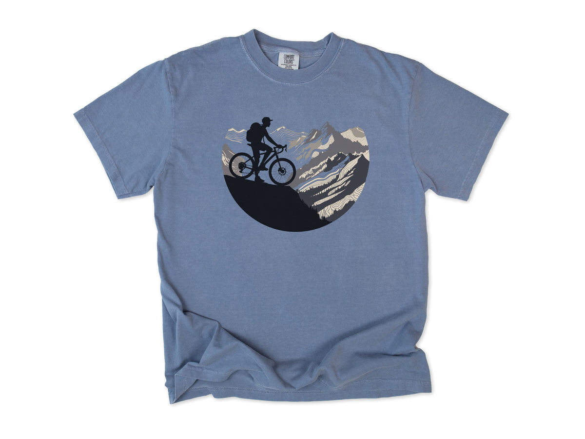Cycling T-shirt in Blue Jean, Cycling Mountain: a mountain biker riding up a rocky mountain, in a circle, for mountain bikers