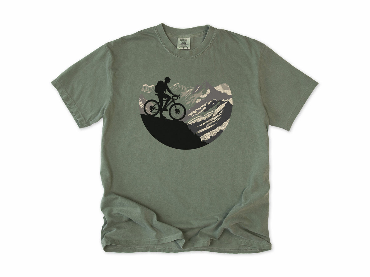 Cycling T-shirt in Moss, Cycling Mountain: a mountain biker riding up a rocky mountain, in a circle, for mountain bikers