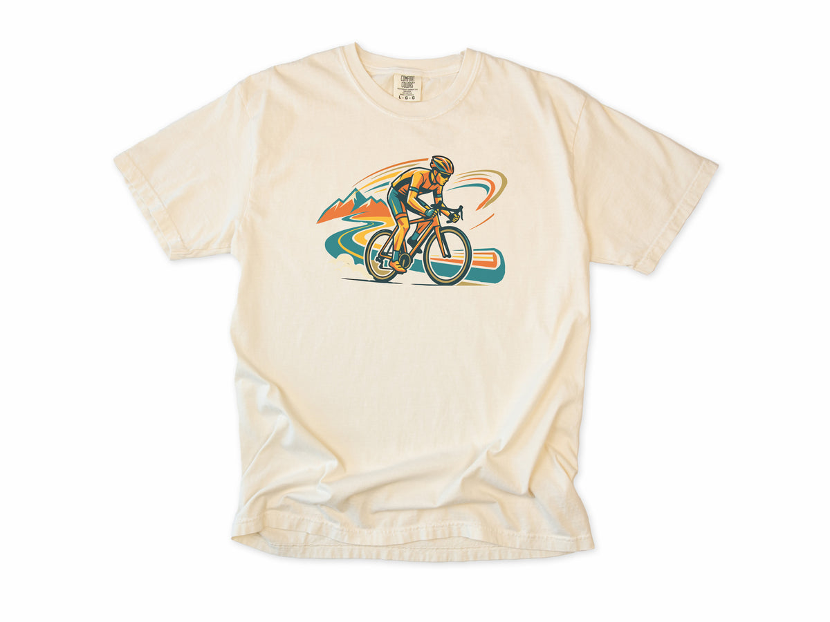 Cycling T-shirt in Ivory, Cycling: a road cyclist racing past mountains in orange, teal and blue swirls, for road cyclists