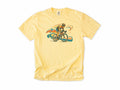 Cycling T-shirt in Butter, Cycling: a road cyclist racing past mountains in orange, teal and blue swirls, for road cyclists