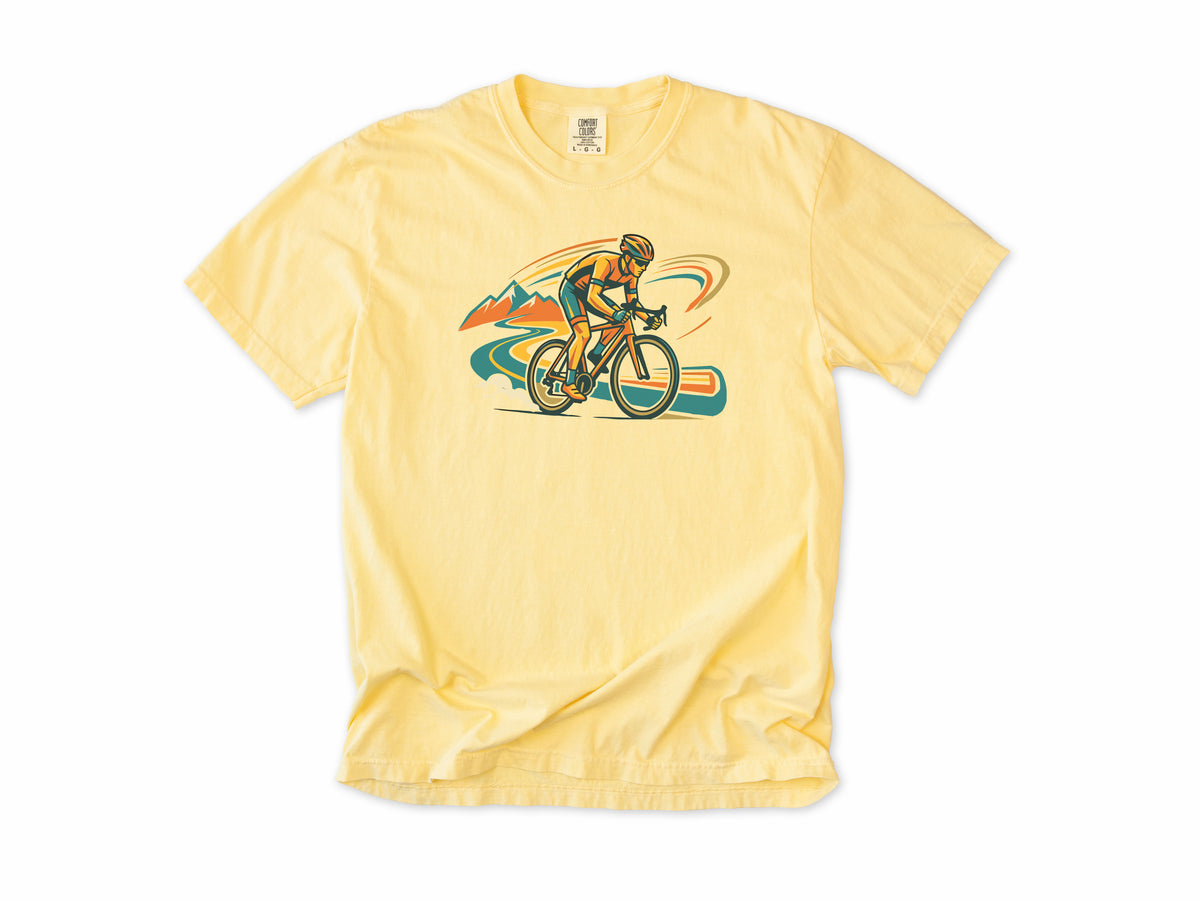 Cycling T-shirt in Butter, Cycling: a road cyclist racing past mountains in orange, teal and blue swirls, for road cyclists