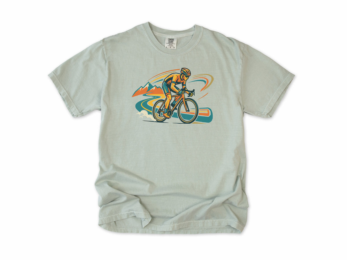 Cycling T-shirt in Bay, Cycling: a road cyclist racing past mountains in orange, teal and blue swirls, for road cyclists