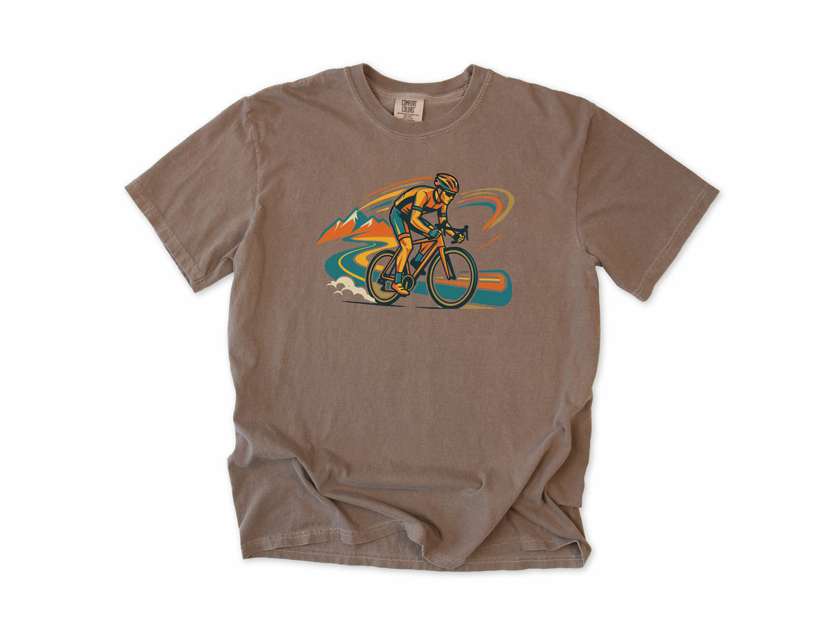 Cycling T-shirt in Espresso, Cycling: a road cyclist racing past mountains in orange, teal and blue swirls, for road cyclists