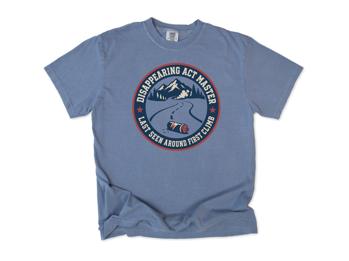 Funny cycling T-shirt in Blue Jean, 'Disappearing Act Master', a mountain road and bottle, for riders who get dropped